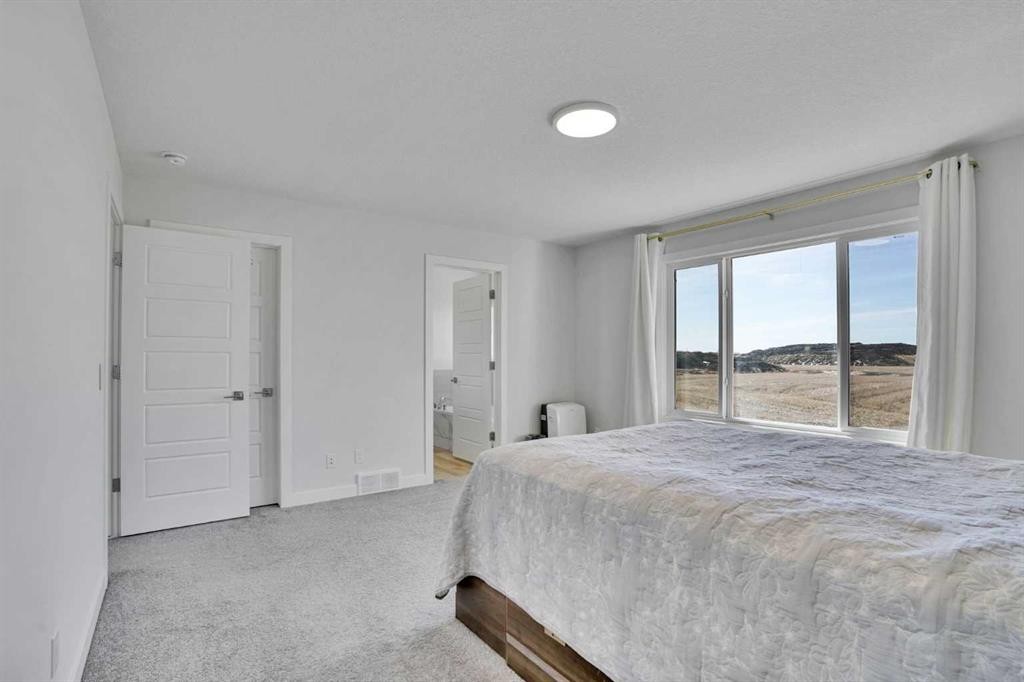 183 Brander Avenue, Langdon, AB - Indoor Photo Showing Bedroom