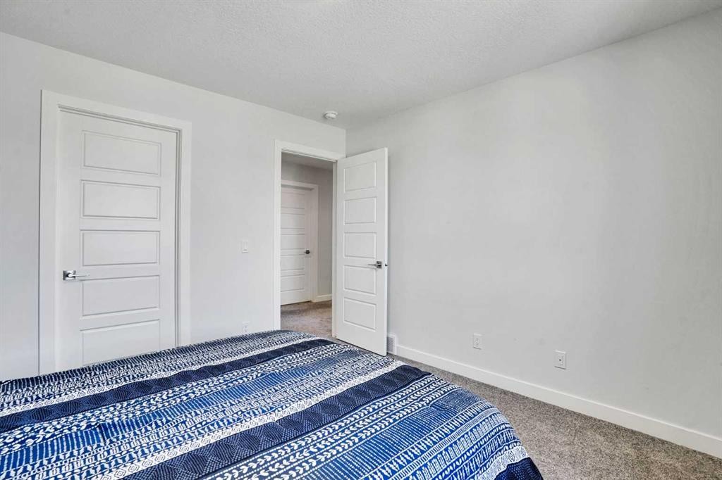 183 Brander Avenue, Langdon, AB - Indoor Photo Showing Bedroom