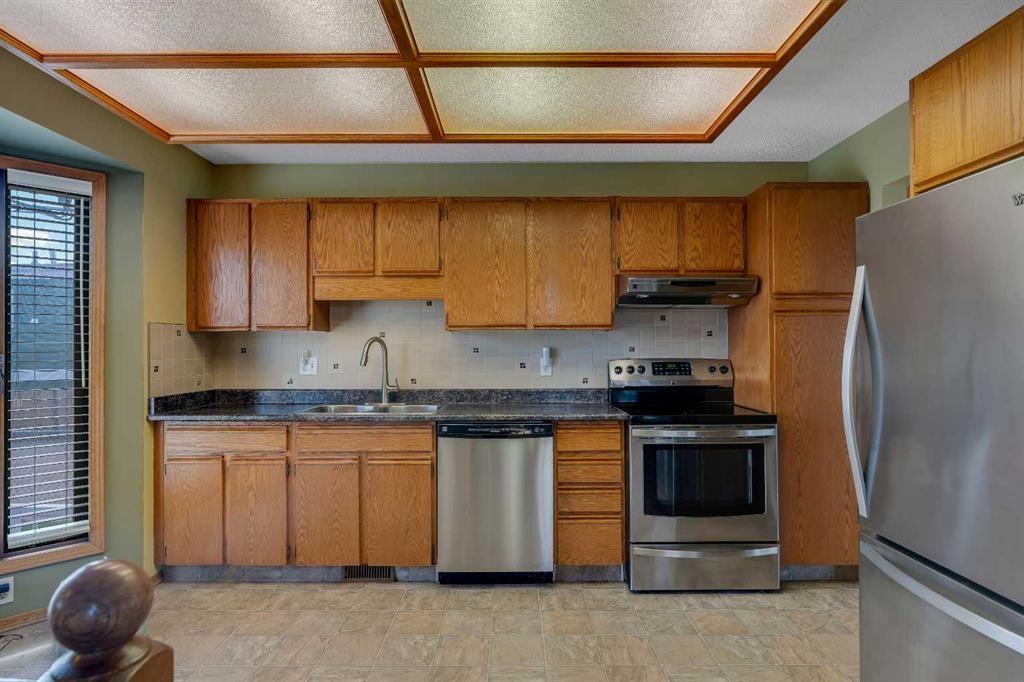 212 Westwood Drive Sw, Calgary, AB - Indoor Photo Showing Kitchen With Stainless Steel Kitchen