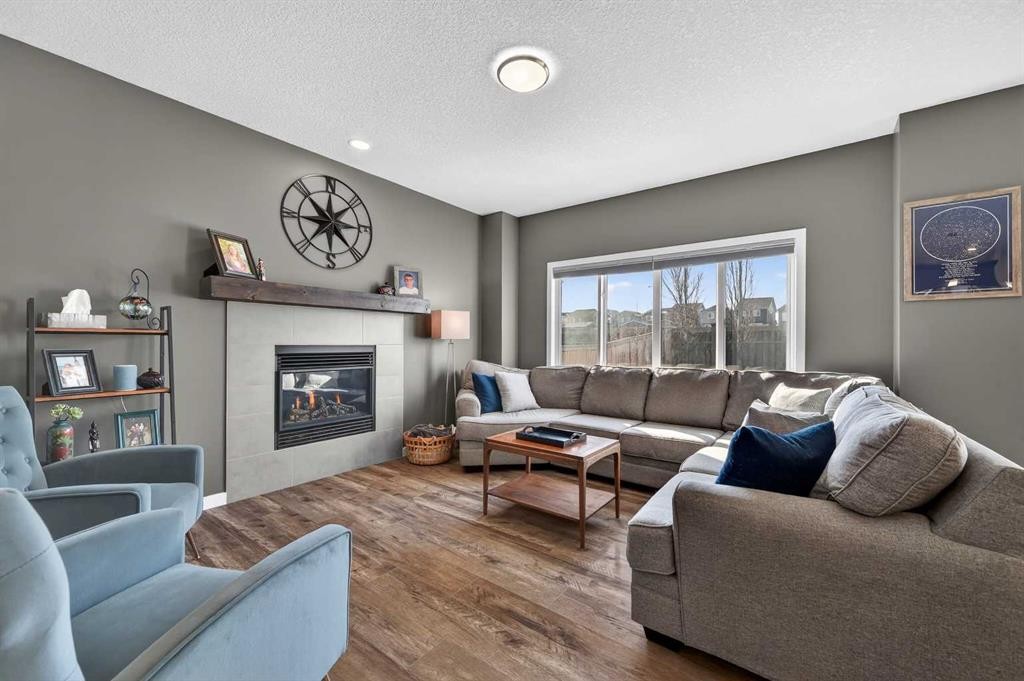 242 Mahogany Passage Se, Calgary, AB - Indoor Photo Showing Living Room With Fireplace