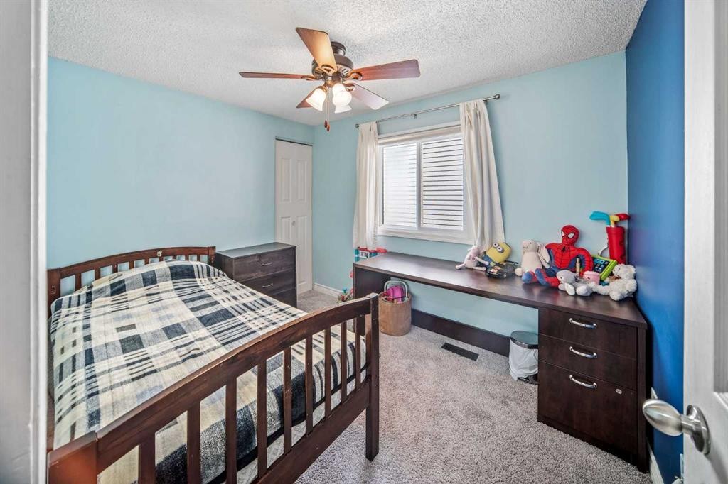 96 Mckinley Road Se, Calgary, AB - Indoor Photo Showing Bedroom