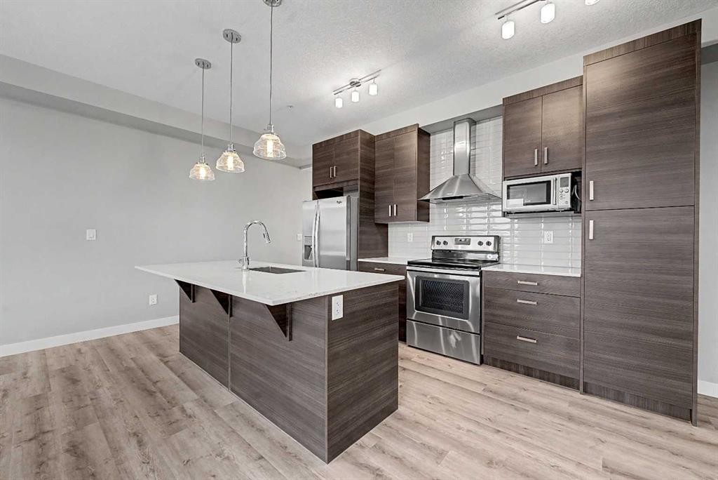 304-10 Walgrove Walk Se, Calgary, AB - Indoor Photo Showing Kitchen With Upgraded Kitchen