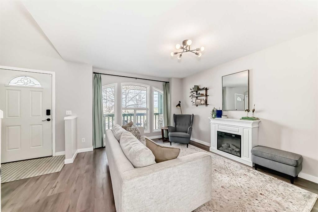 136 Hidden Hills Road Nw, Calgary, AB - Indoor Photo Showing Living Room With Fireplace