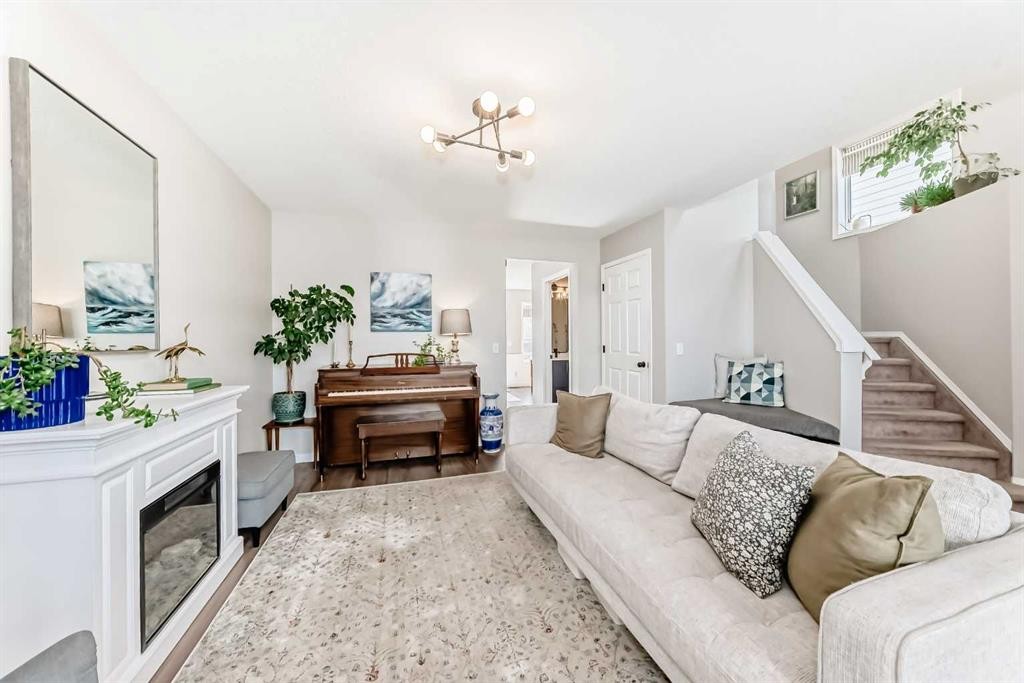 136 Hidden Hills Road Nw, Calgary, AB - Indoor Photo Showing Living Room With Fireplace