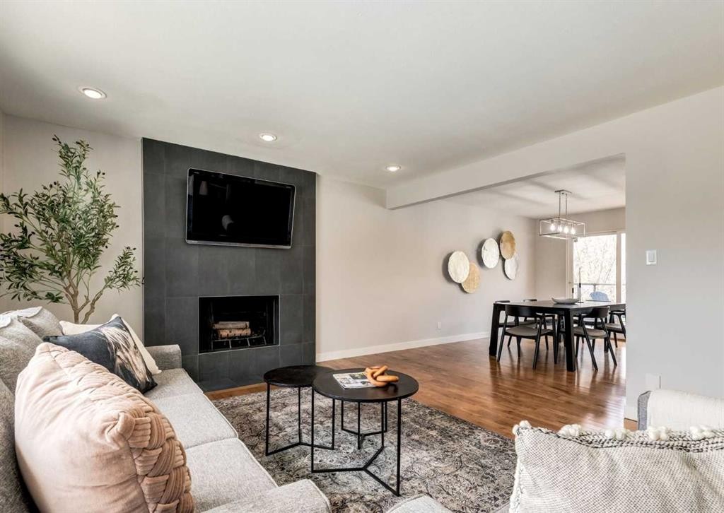 176 Mapleburn Drive Se, Calgary, AB - Indoor Photo Showing Living Room With Fireplace
