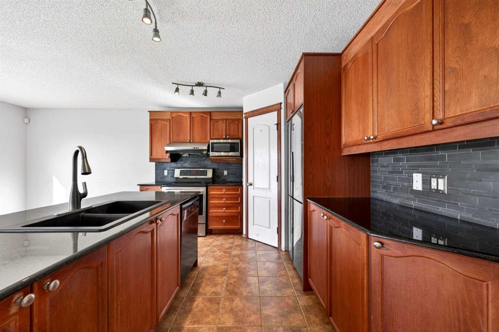 172 Kincora Drive Nw, Calgary, AB - Indoor Photo Showing Kitchen With Double Sink