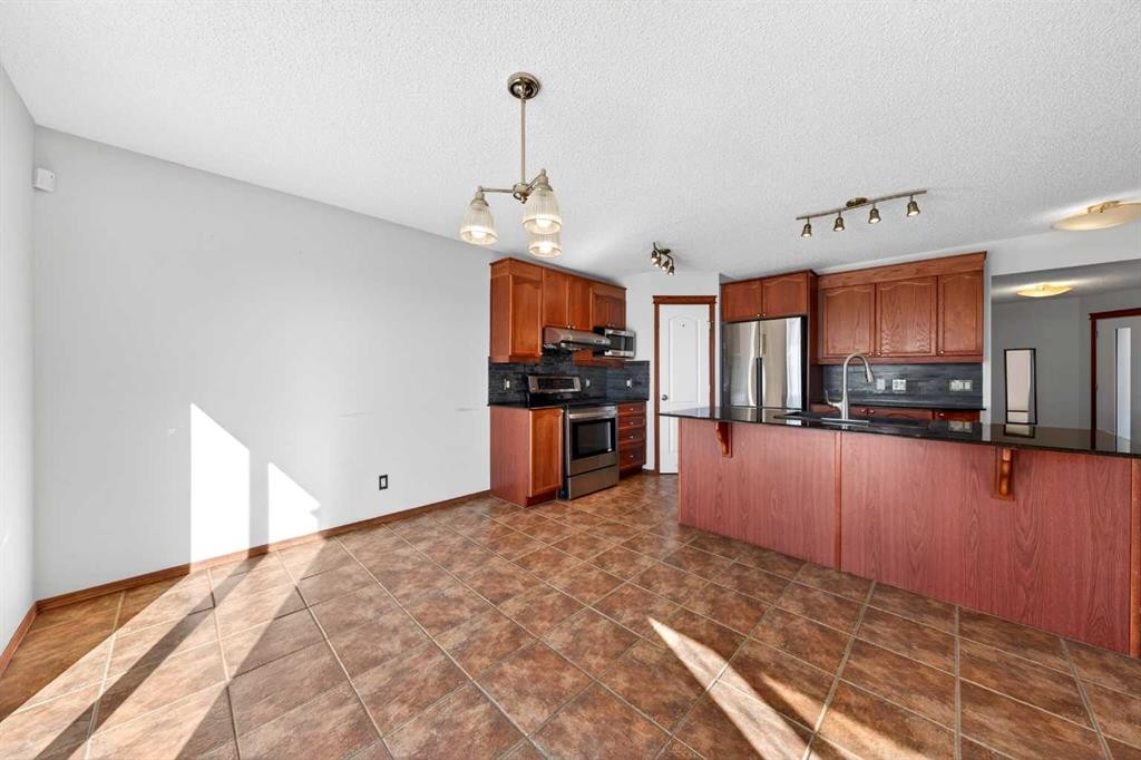 172 Kincora Drive Nw, Calgary, AB - Indoor Photo Showing Kitchen With Stainless Steel Kitchen