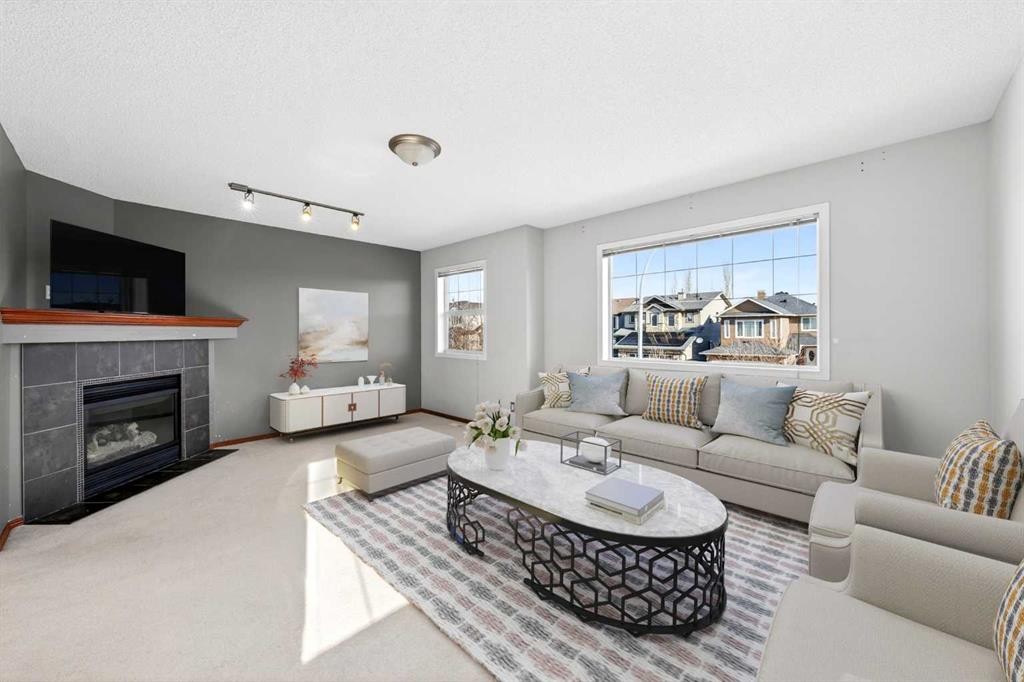 172 Kincora Drive Nw, Calgary, AB - Indoor Photo Showing Living Room With Fireplace