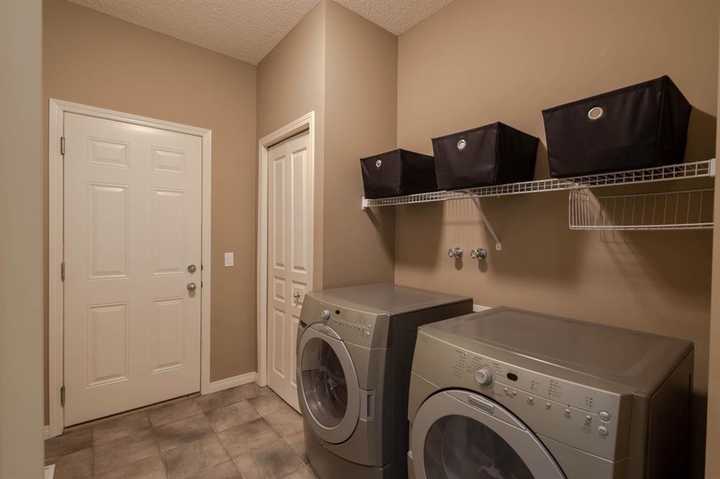74 Valley Crest Rise Nw, Calgary, AB - Indoor Photo Showing Laundry Room