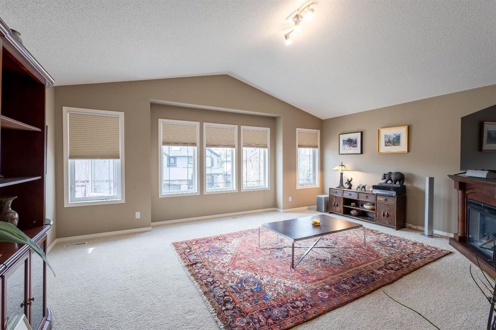 74 Valley Crest Rise Nw, Calgary, AB - Indoor Photo Showing Other Room With Fireplace