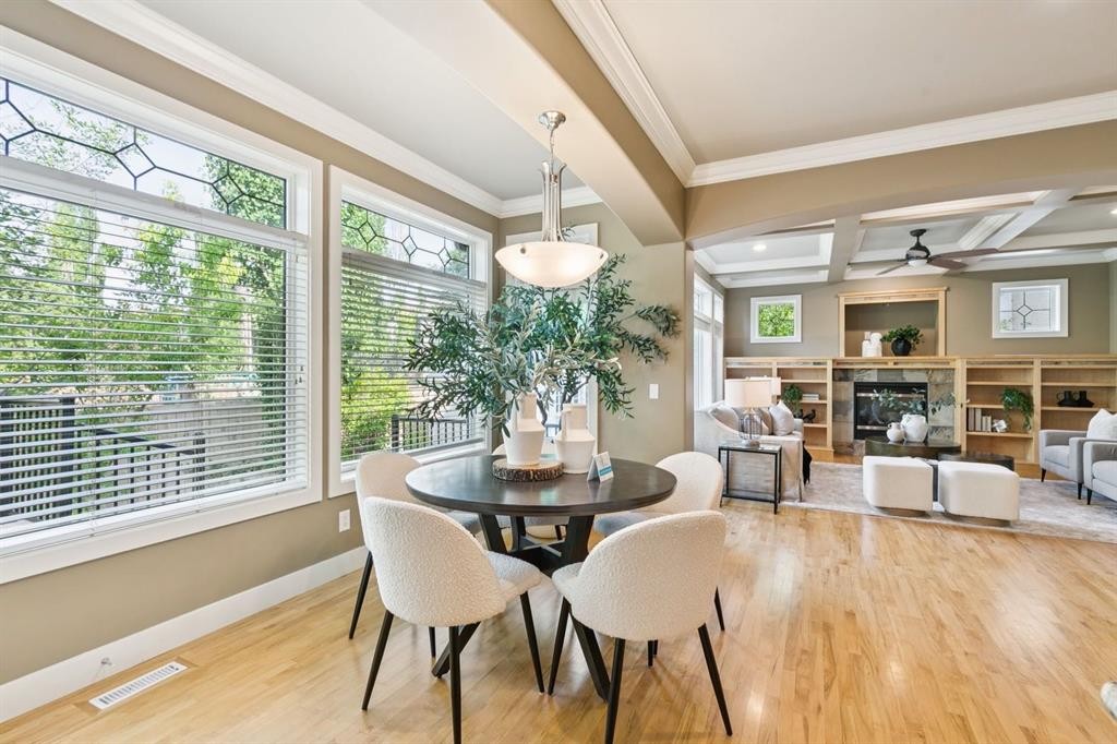 38 Evergreen Common Sw, Calgary, AB - Indoor Photo Showing Dining Room With Fireplace