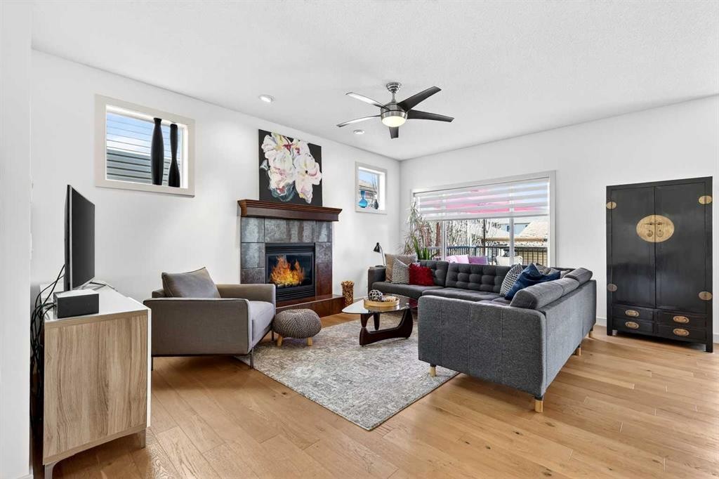 4703 Elgin Avenue Se, Calgary, AB - Indoor Photo Showing Living Room With Fireplace