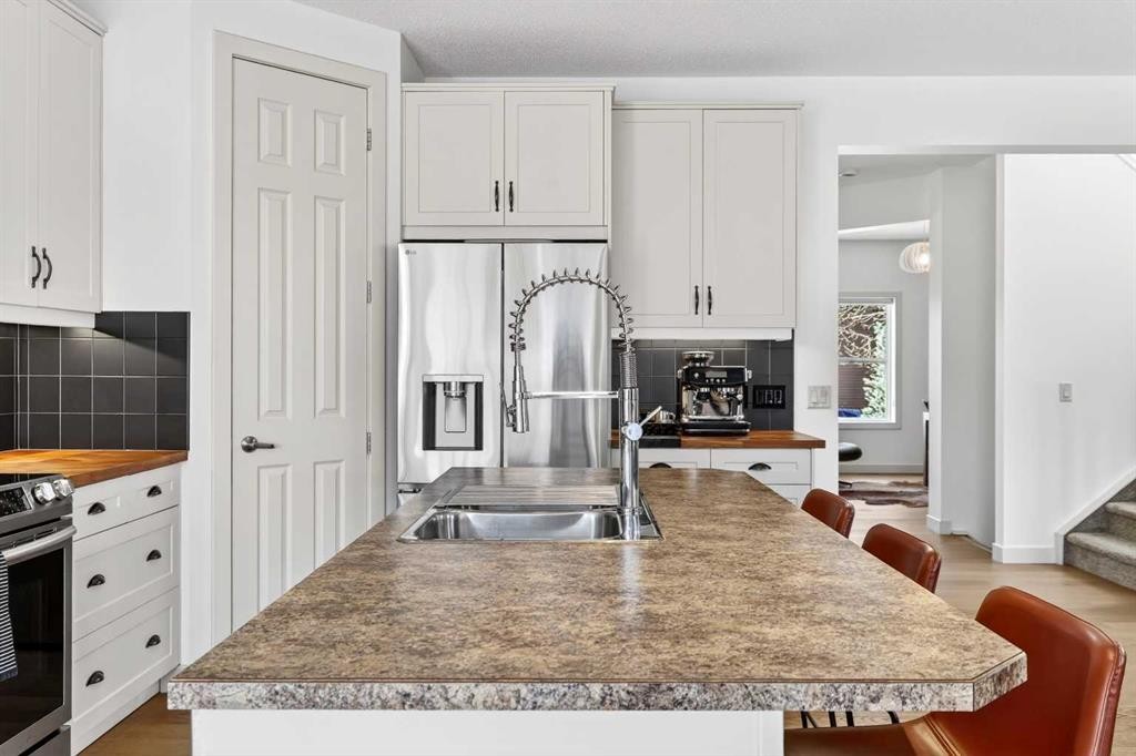 4703 Elgin Avenue Se, Calgary, AB - Indoor Photo Showing Kitchen With Double Sink