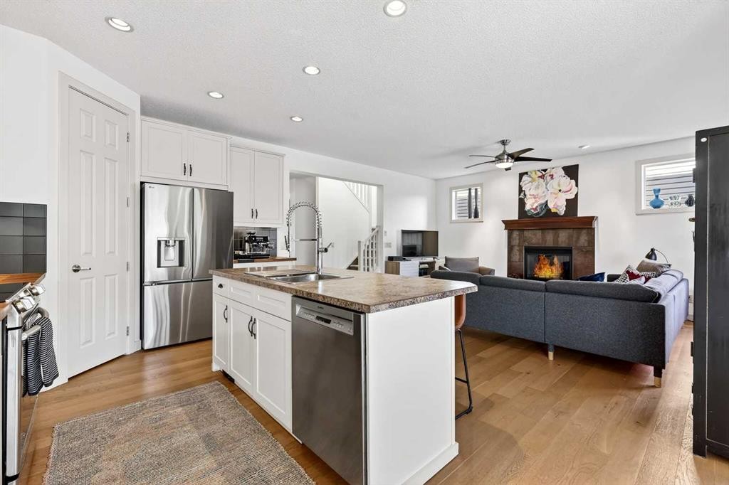 4703 Elgin Avenue Se, Calgary, AB - Indoor Photo Showing Kitchen With Fireplace With Double Sink With Upgraded Kitchen