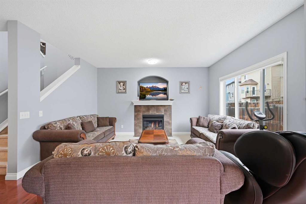 61 Saddleland Drive Ne, Calgary, AB - Indoor Photo Showing Living Room With Fireplace