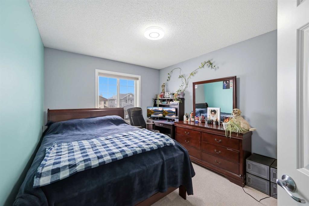 61 Saddleland Drive Ne, Calgary, AB - Indoor Photo Showing Bedroom