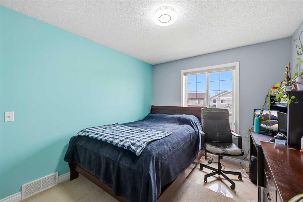 61 Saddleland Drive Ne, Calgary, AB - Indoor Photo Showing Bedroom