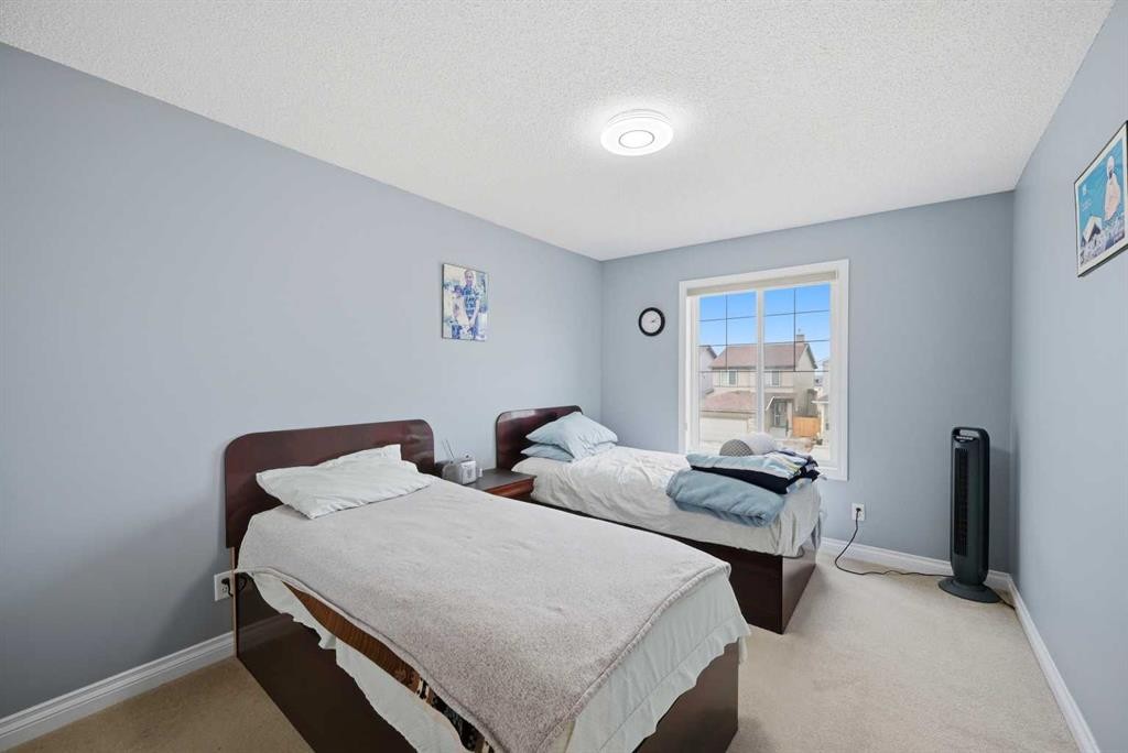 61 Saddleland Drive Ne, Calgary, AB - Indoor Photo Showing Bedroom