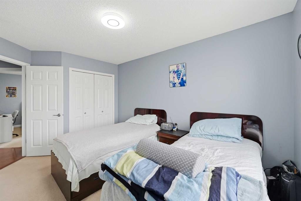 61 Saddleland Drive Ne, Calgary, AB - Indoor Photo Showing Bedroom