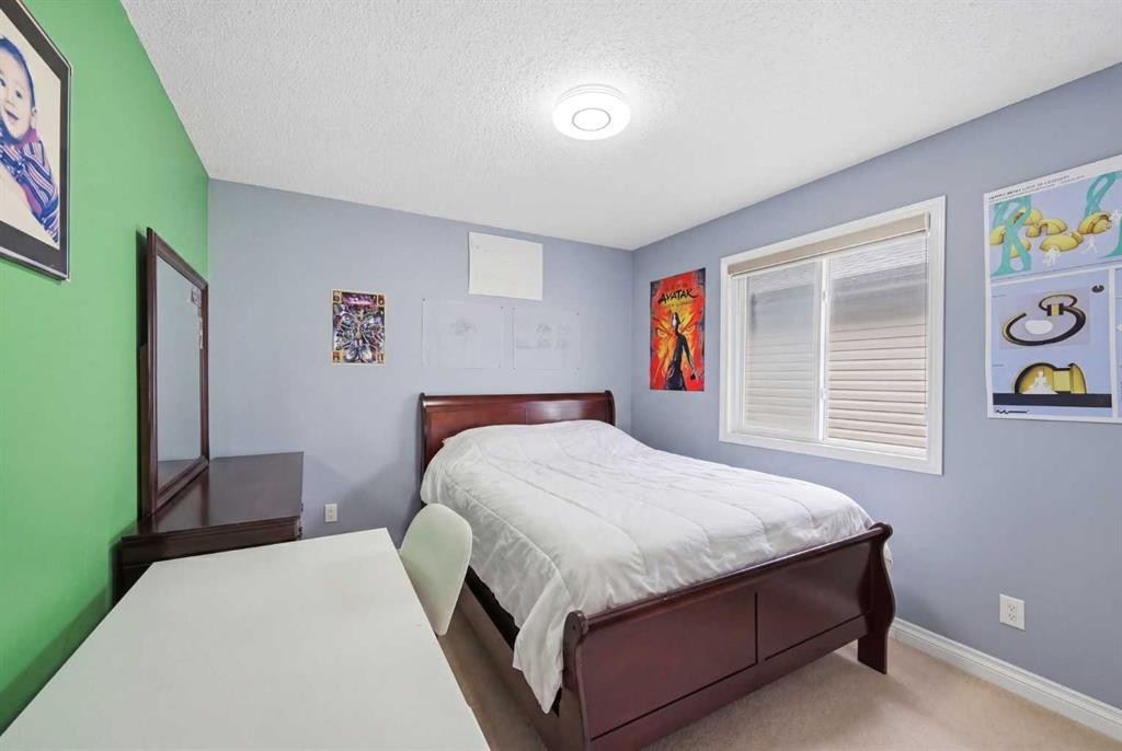 61 Saddleland Drive Ne, Calgary, AB - Indoor Photo Showing Bedroom
