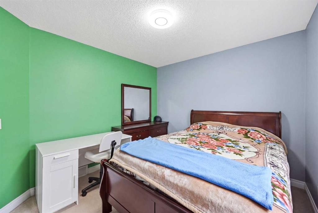 61 Saddleland Drive Ne, Calgary, AB - Indoor Photo Showing Bedroom