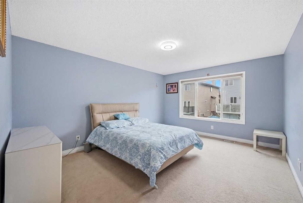 61 Saddleland Drive Ne, Calgary, AB - Indoor Photo Showing Bedroom