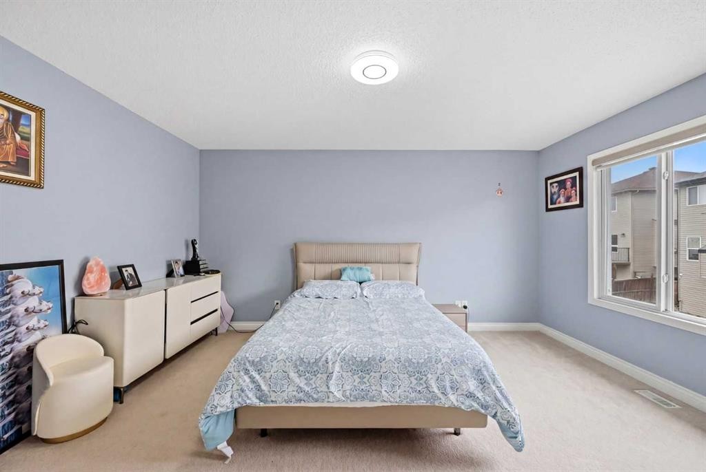61 Saddleland Drive Ne, Calgary, AB - Indoor Photo Showing Bedroom