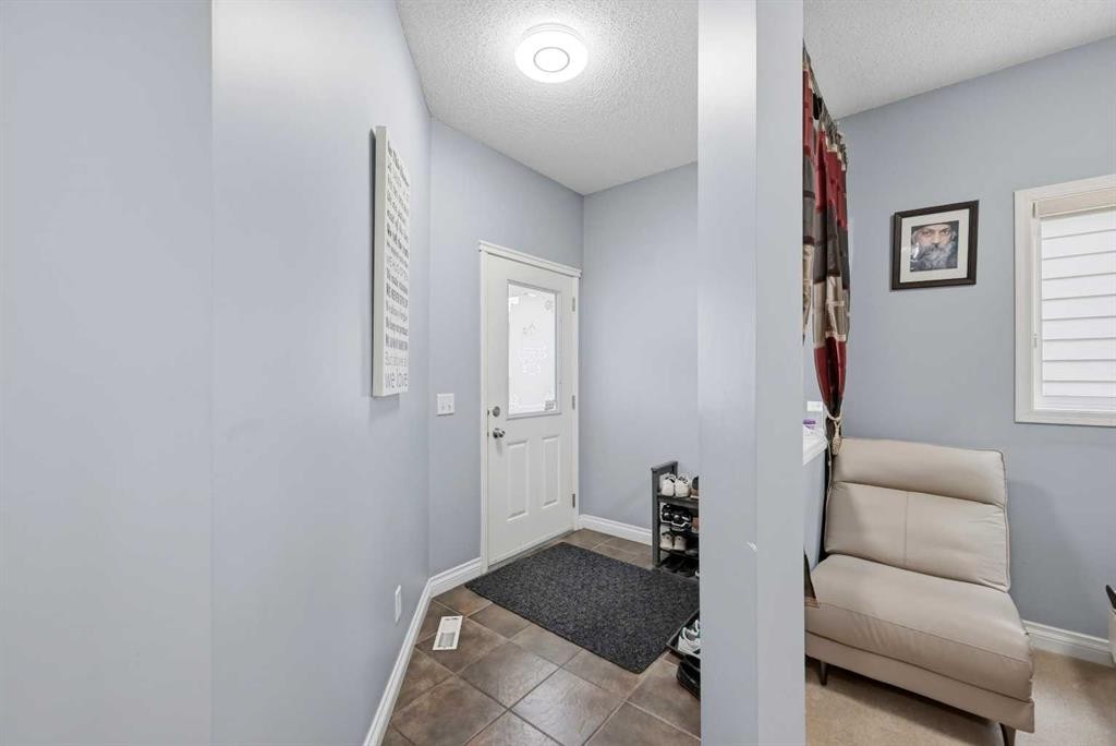 61 Saddleland Drive Ne, Calgary, AB - Indoor Photo Showing Other Room