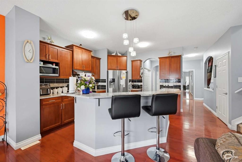 61 Saddleland Drive Ne, Calgary, AB - Indoor Photo Showing Kitchen With Upgraded Kitchen