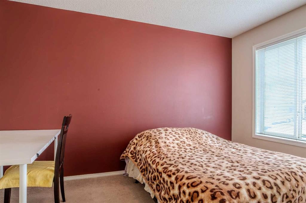 161 Saddlecrest Close Ne, Calgary, AB - Indoor Photo Showing Bedroom