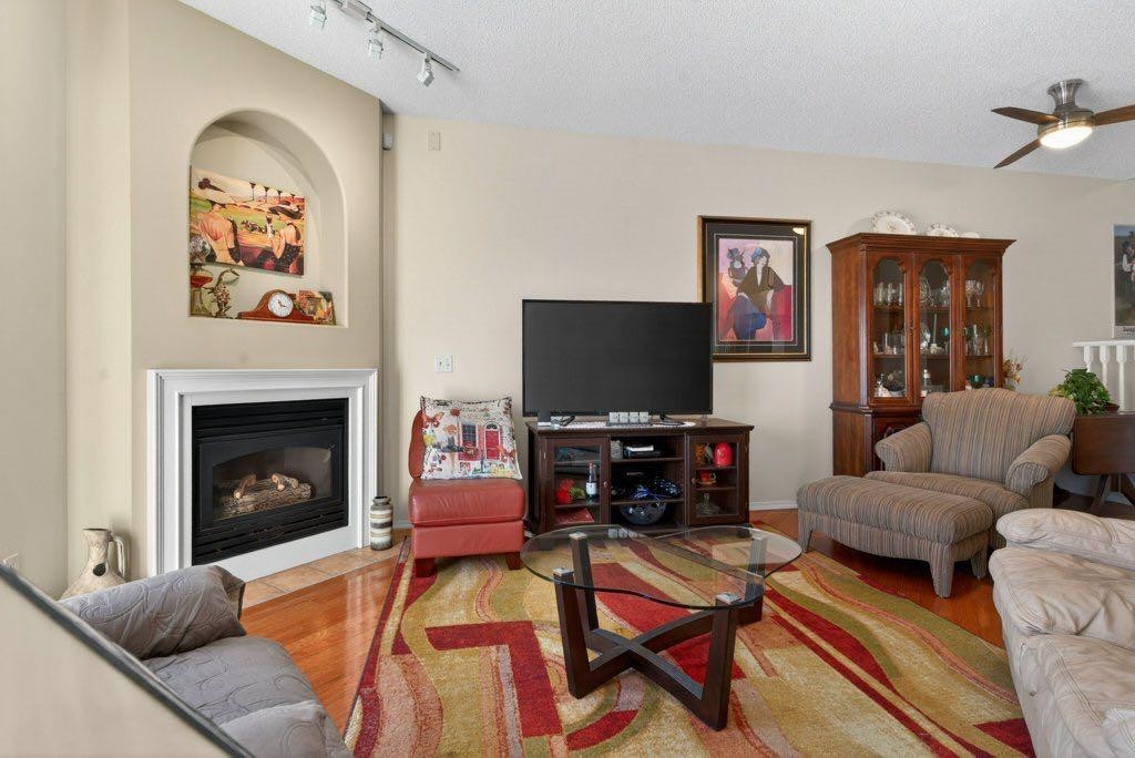 92 Hamptons Link Nw, Calgary, AB - Indoor Photo Showing Living Room With Fireplace