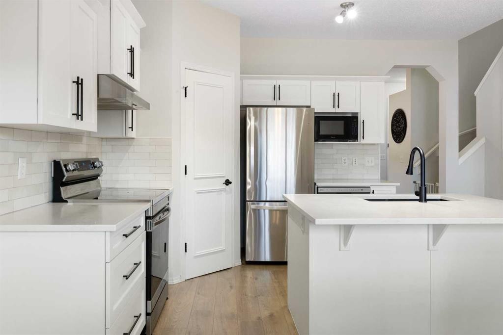 47 Covehaven Mews Ne, Calgary, AB - Indoor Photo Showing Kitchen With Stainless Steel Kitchen With Upgraded Kitchen
