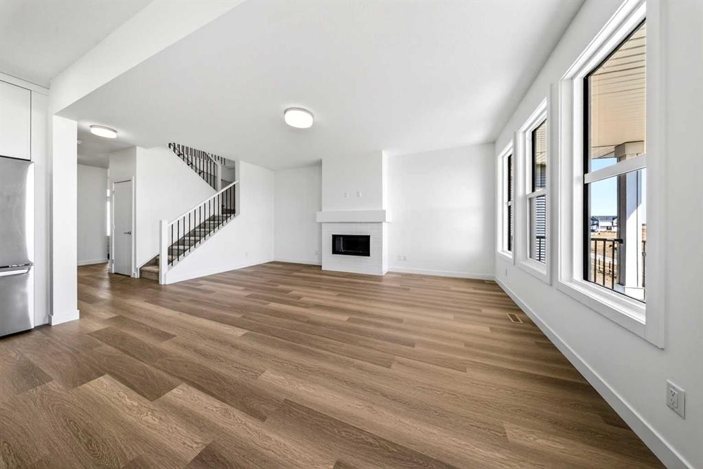 152 Copperhead Road Se, Calgary, AB - Indoor Photo Showing Other Room With Fireplace