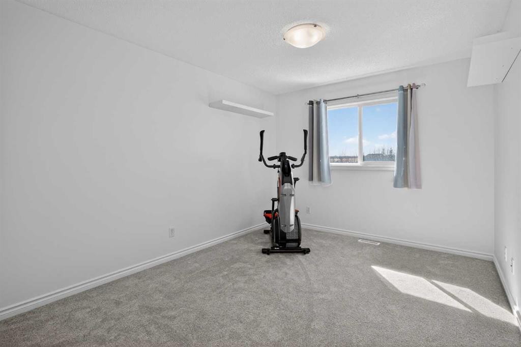268 Westmount Crescent, Okotoks, AB - Indoor Photo Showing Gym Room