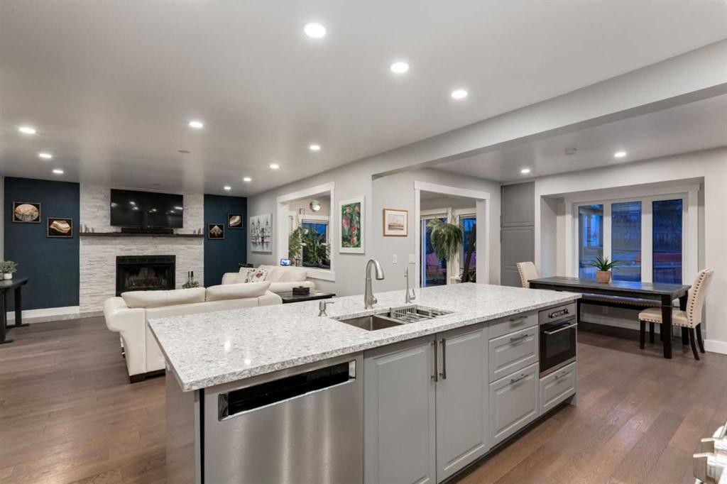 9915 Patton Road Sw, Calgary, AB - Indoor Photo Showing Kitchen With Fireplace With Double Sink With Upgraded Kitchen