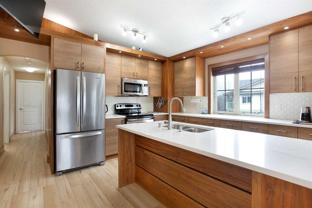2201-230 Eversyde Boulevard Sw, Calgary, AB - Indoor Photo Showing Kitchen With Double Sink