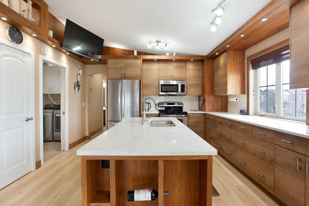 2201-230 Eversyde Boulevard Sw, Calgary, AB - Indoor Photo Showing Kitchen With Double Sink With Upgraded Kitchen