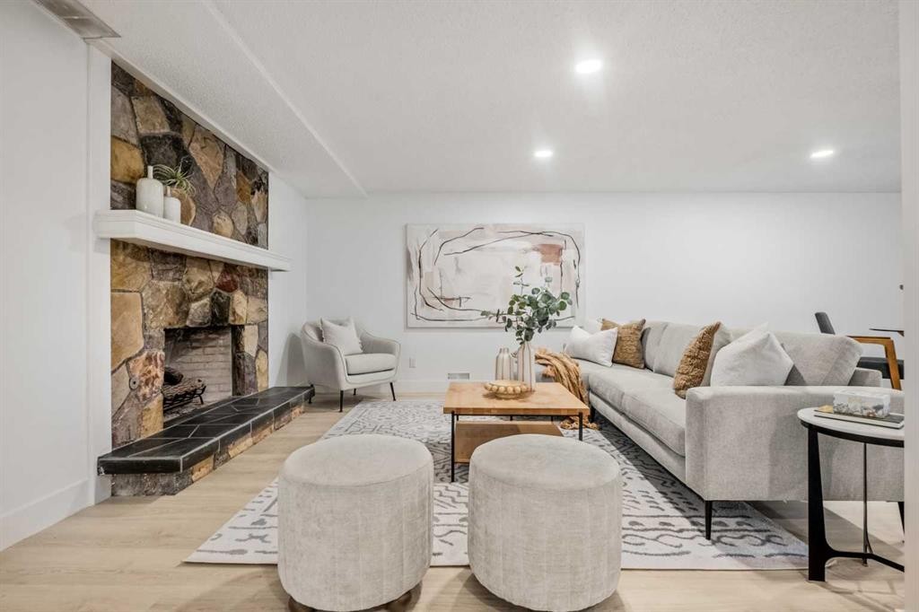 235 Lake Rosen Crescent Se, Calgary, AB - Indoor Photo Showing Living Room With Fireplace