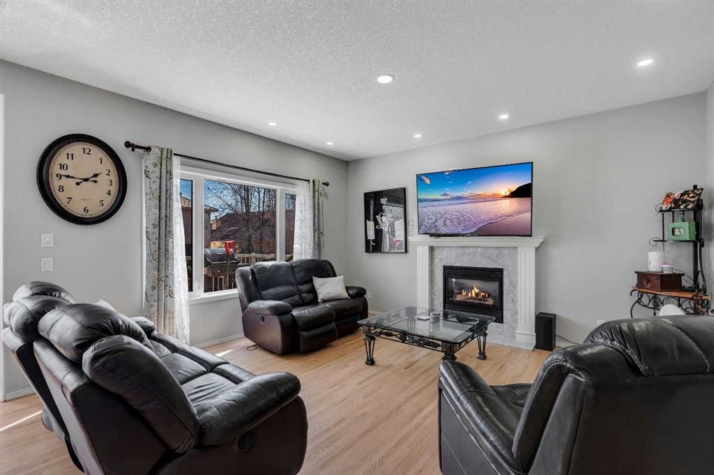 37 Mt Yamnuska Place Se, Calgary, AB - Indoor Photo Showing Living Room With Fireplace