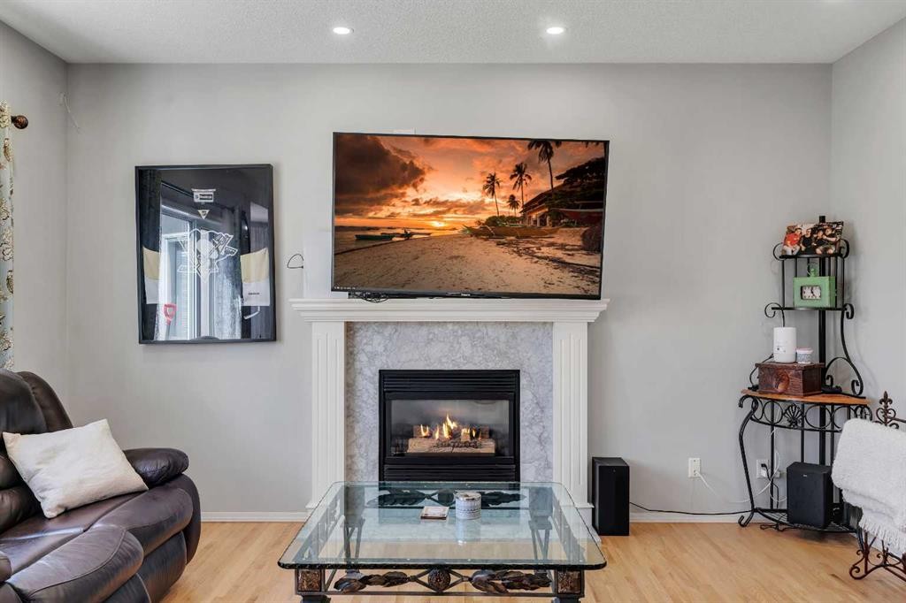 37 Mt Yamnuska Place Se, Calgary, AB - Indoor Photo Showing Living Room With Fireplace