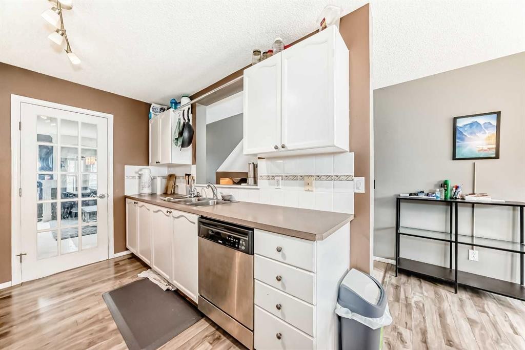 112 Country Village Cape Ne, Calgary, AB - Indoor Photo Showing Kitchen With Double Sink