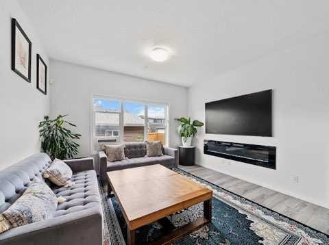 136 Lucas Street Nw, Calgary, AB - Indoor Photo Showing Living Room With Fireplace