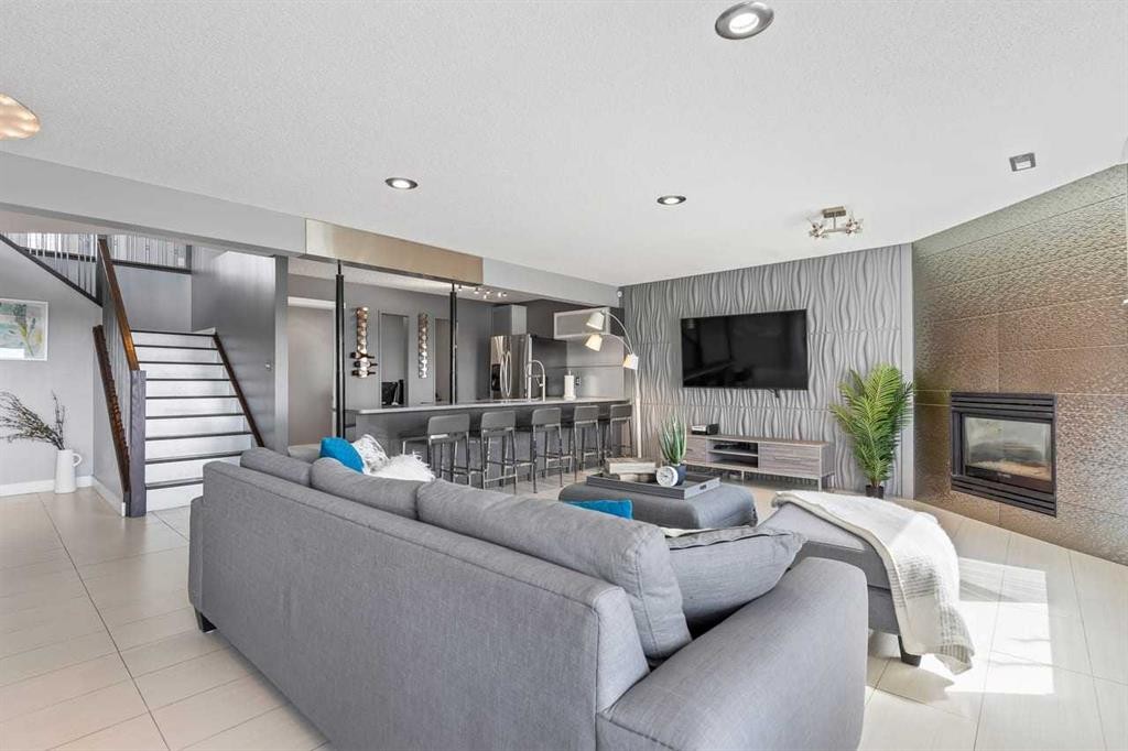 12 Arbour Estates Green Nw, Calgary, AB - Indoor Photo Showing Living Room With Fireplace