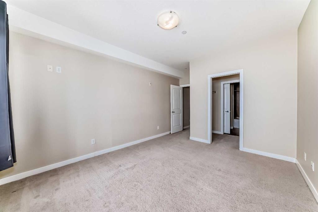 206-1005B Westmount Drive, Strathmore, AB - Indoor Photo Showing Other Room