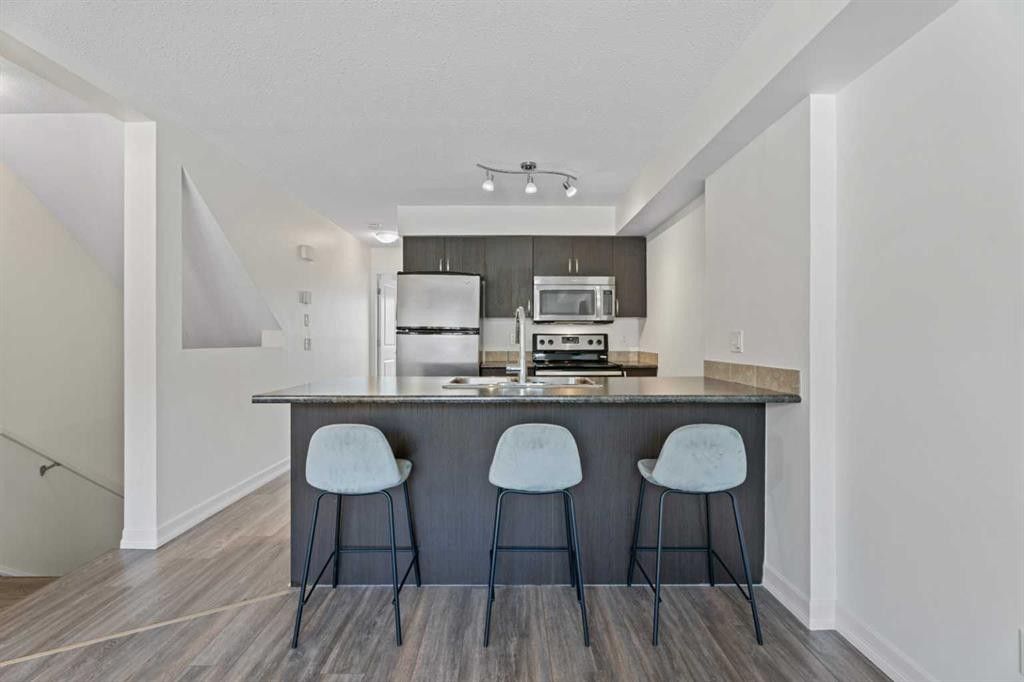 410-121 Copperpond Common Se, Calgary, AB - Indoor Photo Showing Kitchen With Stainless Steel Kitchen With Upgraded Kitchen