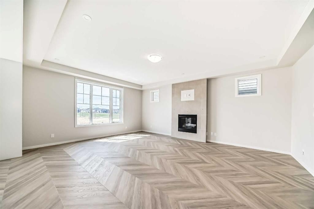 641 Windrow Manor Sw, Airdrie, AB - Indoor With Fireplace