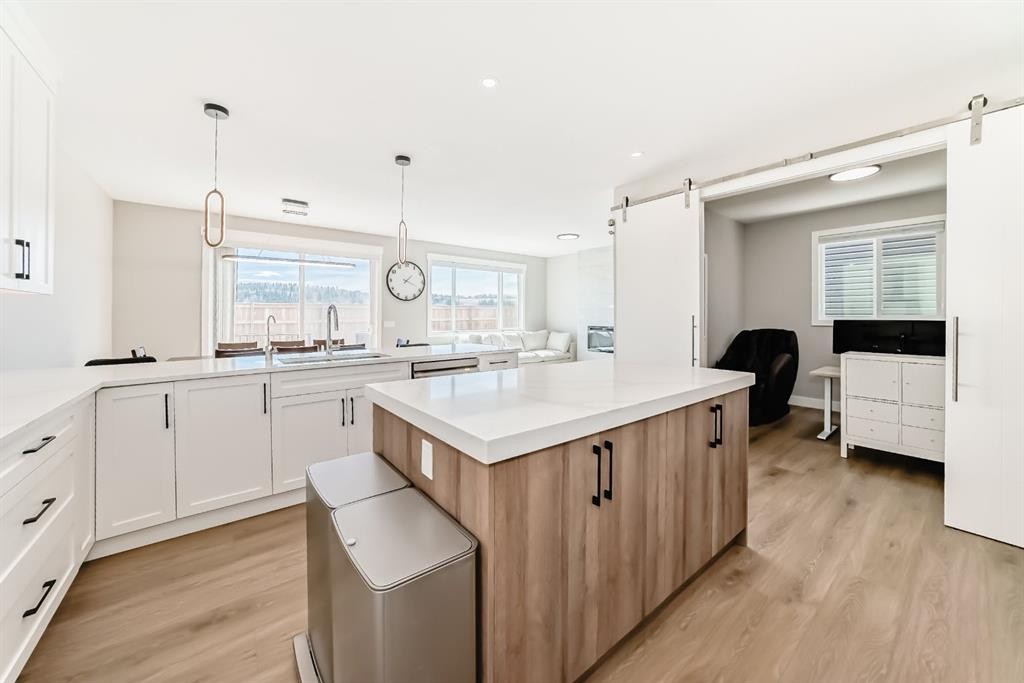 80 Vantage Drive, Cochrane, AB - Indoor Photo Showing Dining Room With Fireplace