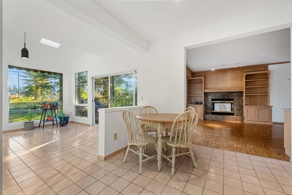 907 Shawnee Drive Sw, Calgary, AB - Indoor With Fireplace
