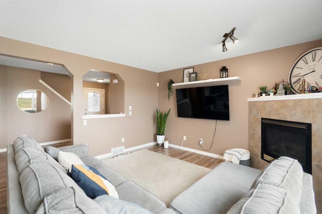 459 Citadel Meadow Bay Nw, Calgary, AB - Indoor Photo Showing Living Room With Fireplace