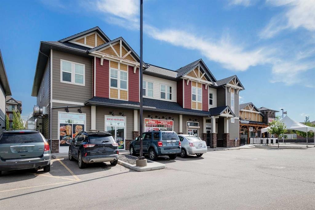 140 Sundown Road, Cochrane, AB - Outdoor With Facade